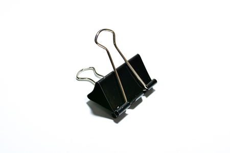Black paper clip isolated on white backgroundの写真素材