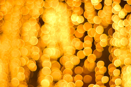 Abstract Background of blurred yellow lights with bokeh effectの写真素材
