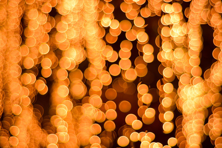 Abstract Background of blurred orange lights with bokeh effectの写真素材