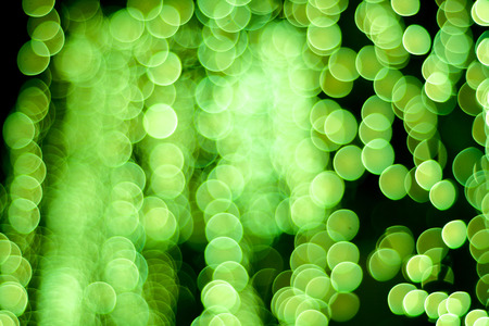 Abstract Background of blurred green lights with bokeh effectの写真素材