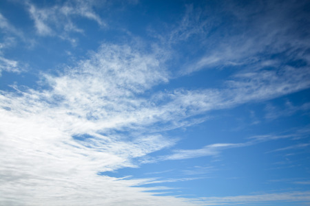 Blue sky with white cloud backgroundの写真素材