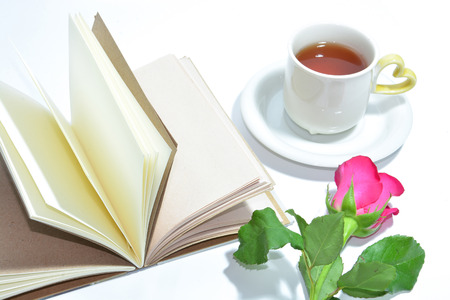 a tea cup of love , handmade book and pink roseの写真素材