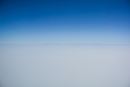 Clear blue sky with horizon line for backgroundの写真素材
