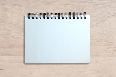 white page of notebook on wood texture backgroundの写真素材
