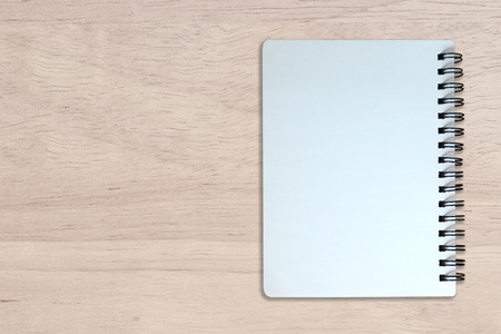 white page of notebook on wood texture backgroundの写真素材