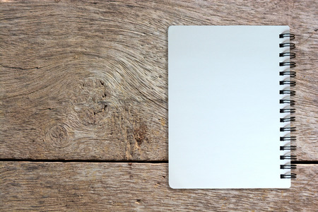 white page of notebook on wood texture backgroundの写真素材