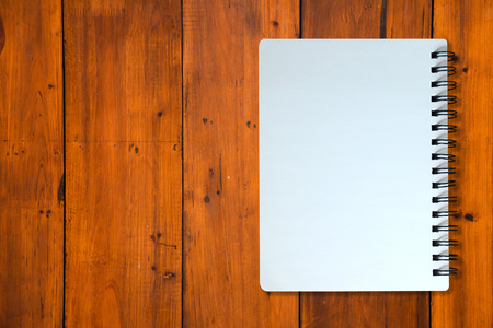 White page of notebook on wood patternの写真素材