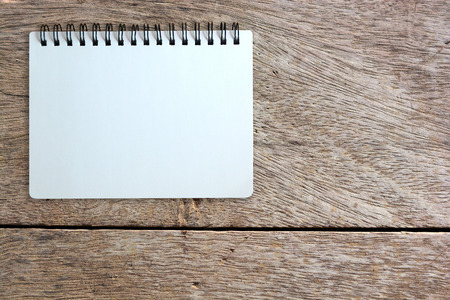 white page of notebook on wood texture backgroundの写真素材