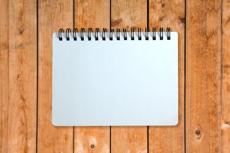 White page of notebook on wood patternの写真素材