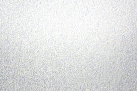 closeup of white plaster wall texture backgroundの写真素材