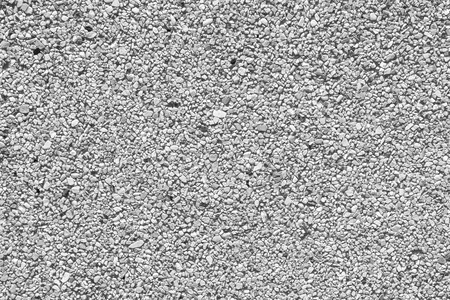 closeup of gray pebble stones wall texture backgroundの写真素材