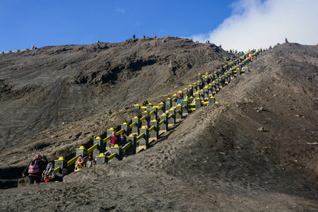 Java Indonesia  JAN 24 2013: Tourists climbing the stairway leading to the rim of Mount Bromo in Java Indonesia.のeditorial素材