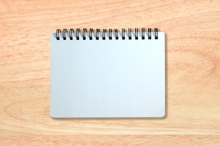 white page of notebook on wood texture backgroundの写真素材