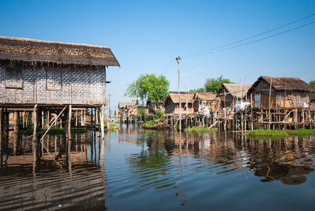 INLE LAKE MYANMAR  APRIL 10: Floating houses in a village on APRIL 10 2012 in Inle Lake Myanmar. Inle lake is a famous lake for tourism in Myanmar.の写真素材