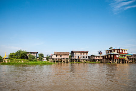 INLE LAKE MYANMAR  APRIL 10: Floating houses in a village on APRIL 10 2012 in Inle Lake Myanmar. Inle lake is a famous lake for tourism in Myanmar.のeditorial素材