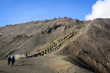 Java Indonesia  JAN 24 2013: Tourists climbing the stairway leading to the rim of Mount Bromo in Java Indonesia.のeditorial素材