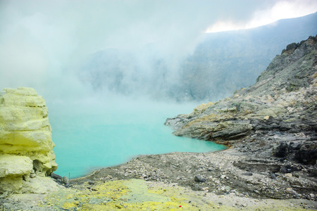 Turquoise lake at the center of Kawah Ijen volcano travel destination in East Java  Indonesiaの写真素材