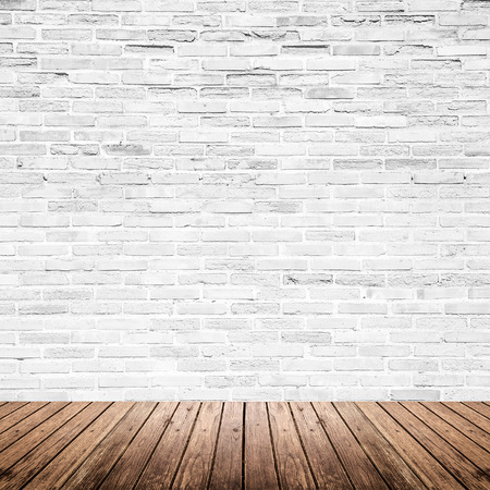 Old interior room with broken white brick wall and grunge wood floor texture