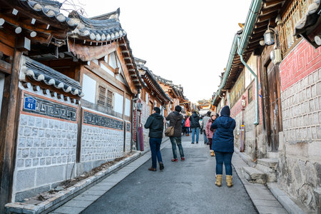 SEOUL, SOUTH KOREA - OCTOBER 2, 2014 : Tourists walk in the beautiful scenery around Bukchon Hanok Village,Traditional Korean style architecture in Seoul, South Korea.のeditorial素材