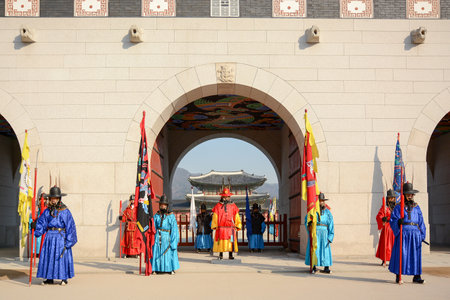 SEOUL, SOUTH KOREA - OCTOBER 3, 2014 : Royal guards at Gwanghwamun Gate, the entrance of Gyeongbokgung Palace in Seoul, South Korea.のeditorial素材