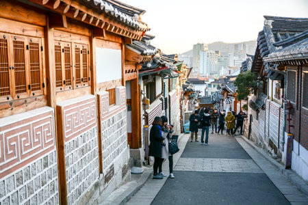 SEOUL, SOUTH KOREA - OCTOBER 2, 2014 : Tourists walk in the beautiful scenery around Bukchon Hanok Village,Traditional Korean style architecture in Seoul, South Korea.のeditorial素材