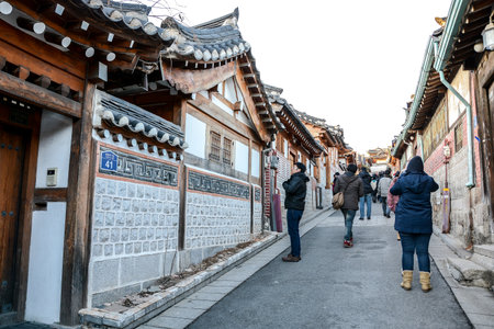 SEOUL, SOUTH KOREA - OCTOBER 2, 2014 : Tourists walk in the beautiful scenery around Bukchon Hanok Village,Traditional Korean style architecture in Seoul, South Korea.のeditorial素材