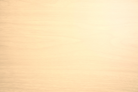 closeup detail of abstract beige wood texture background with light on top rightの写真素材