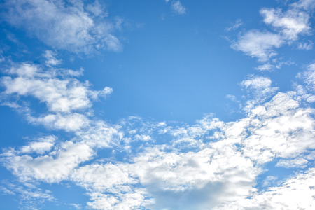 Blue sky and white clouds background with day light of summerの写真素材