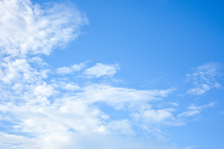 Blue sky and white clouds background with day light of summerの写真素材