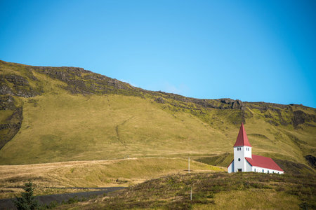 Church on hill in Vik, Little town of Southern Icelandの写真素材
