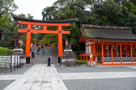 KYOTO, JAPAN - NOVEMBER 18, 2015 : Tourist walk in Fushimi Inari shrine, one of famous landmarks in Kyoto, Japanのeditorial素材