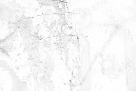 closeup surface detail of old white crack grunge concrete wall - use for background in architecture, structure or building conceptsの写真素材