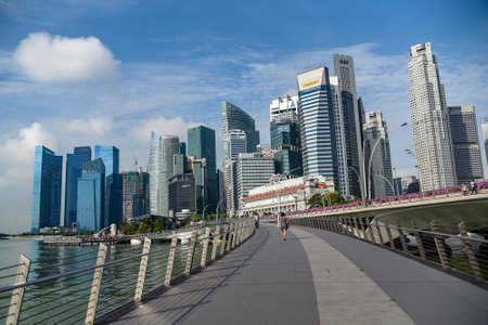 SINGAPORE - MAY 6, 2016 : Cityscape of Singapore business district skyline and pedestrian walkway on Jubilee bridge.のeditorial素材