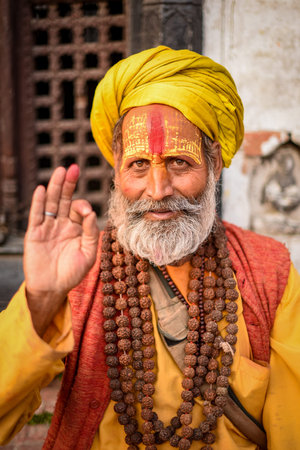 KATHMANDU, NEPAL - APRIL 17, 2016 : Portrait of Shaiva sadhu (holy man) with traditional painted face in Pashupatinath Temple.のeditorial素材