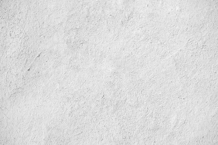 closeup of old white stucco clay wall, rough surface background with abstract grain detail or backdrop in architectural material conceptの写真素材