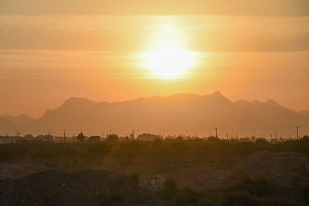 scenic mountain landscape at sunset, beautiful orange tone nature background in summer seasonの写真素材