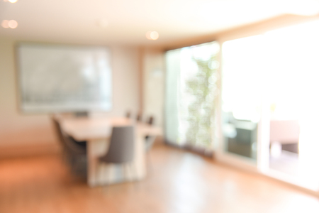 abstract blur office meeting room interior background or backdrop, blurred empty vintage boardroom workspace for presentation and teleconference conceptsの写真素材