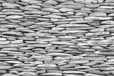 abstract white stone wall pattern, natural surface texture for background or backdrop in construction material and design element conceptsの写真素材