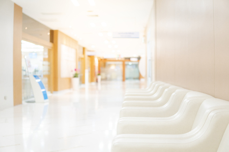 Sofa in waiting area of luxury hospital. Clinic corridor interior background. Healthcare and medical conceptの写真素材