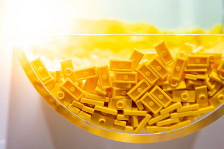 Close up of plastic toy bricks inside self service container shelf display in Kids toy store.の写真素材