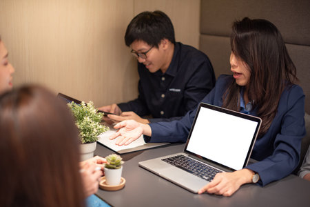 Business meeting and teamwork concept. Asian businesswoman explaining project data report to...