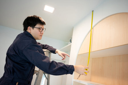 Home renovation or House remodeling concept. Asian male furniture assembler or Interior construction...