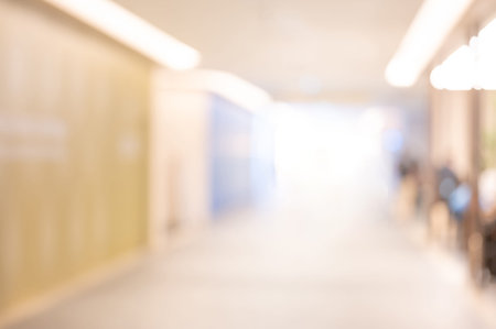 Abstract blur reception hall corridor in business office building. Blurred lobby interior in luxury hotel. Use as background or backdrop for design elementの写真素材