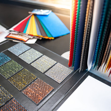 Set of colorful fabric swatch material. Various color and texture fabric pieces with carpet sample...