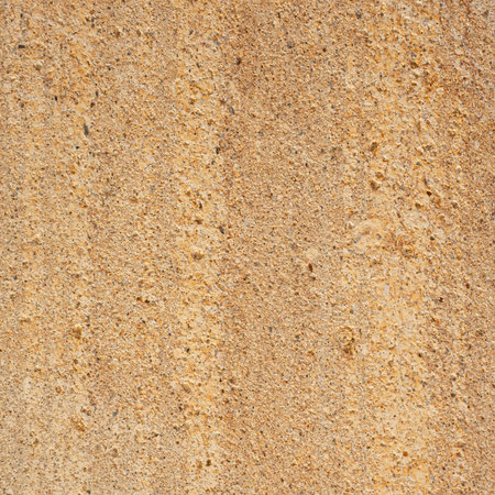 Close up detail of beige rough concrete wall texture. Design element use for background or backdrop in architecture and construction conceptの写真素材