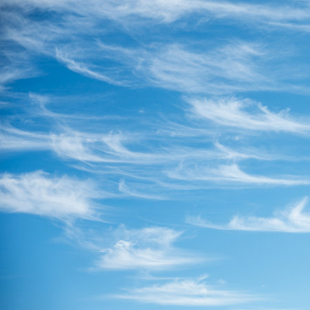 Soft white cirrus clouds against the blue sky on a sunny day. Empty space use for background or backdrop in nature conceptの写真素材