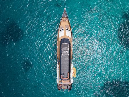 Aerial view of scuba diving boat or recreational vessel anchoring over turquoise clear water at Racha Island or Koh Racha, A popular destination for summer vacationの写真素材