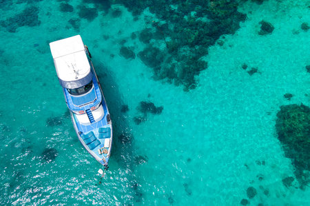 Aerial view of recreational vessel or scuba diving boat anchoring together over turquoise clear water at Racha Island or Koh Racha, A popular destination for summer vacation in Phuket, Thailand.の写真素材