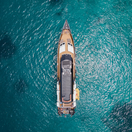 Aerial view of scuba diving boat or recreational vessel anchoring over turquoise clear water at Racha Island or Koh Racha, A popular destination for summer vacationの写真素材