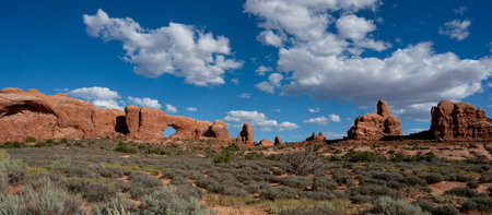 Panoramic view of North Window and Turret arch on a sunny day at Arches National Park near Moab in...